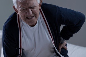 Senior man suffering for terrible pain of lower back